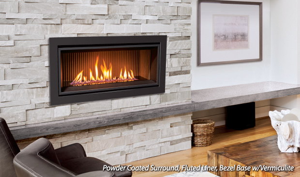 Enviro C34 linear gas fireplace set in a white stone wall above a leather sofa