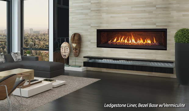 Enviro C60 linear gas fireplace in a city loft with carved masks on the wall