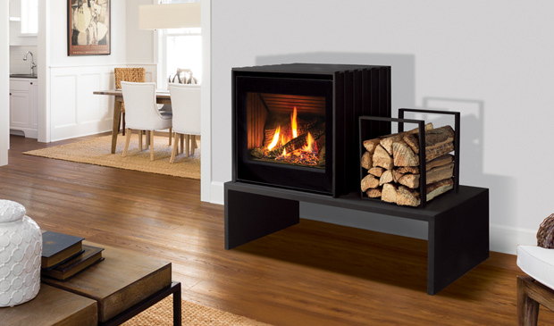 Enviro Cube gas stove with its wood rack in a kitchen corner