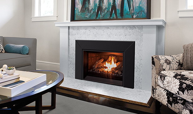 Enviro E25 gas insert in a white mantel below teal artwork
