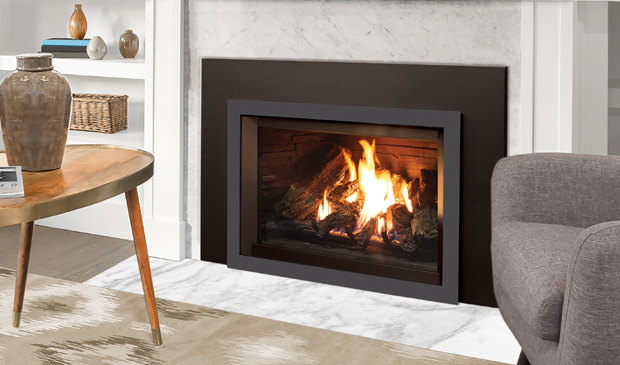 Enviro E30 insert warming a reading corner with a grey armchair
