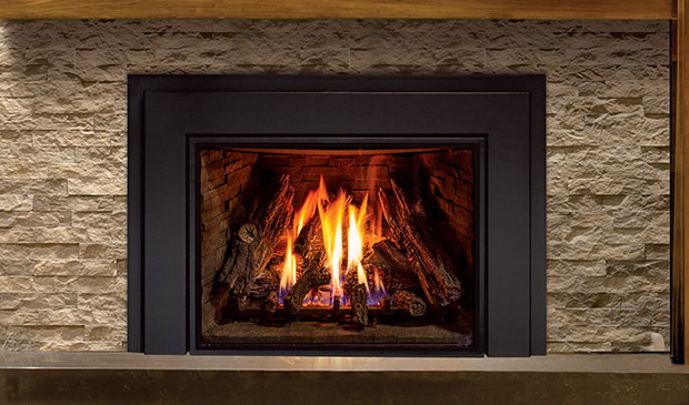 Enviro E44 insert glowing in a stacked stone wall
