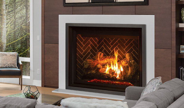 Enviro G50 gas fireplace in a white surround beside a grey sofa