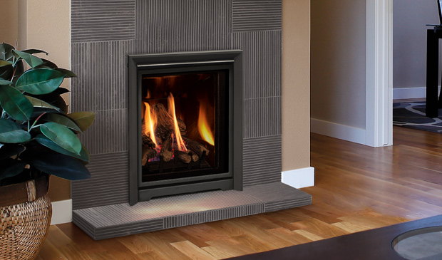 Enviro Q1 insert in a tiled surround beside a plant