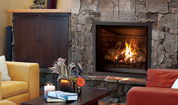 Enviro Q2 gas fireplace in a stone wall between wood cabinets and yellow chairs