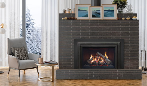 Enviro RI30 insert in a grey brick chimney with snow outside