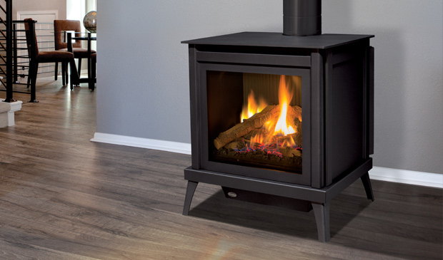Enviro S40 freestanding gas stove in a dining room with wood floors