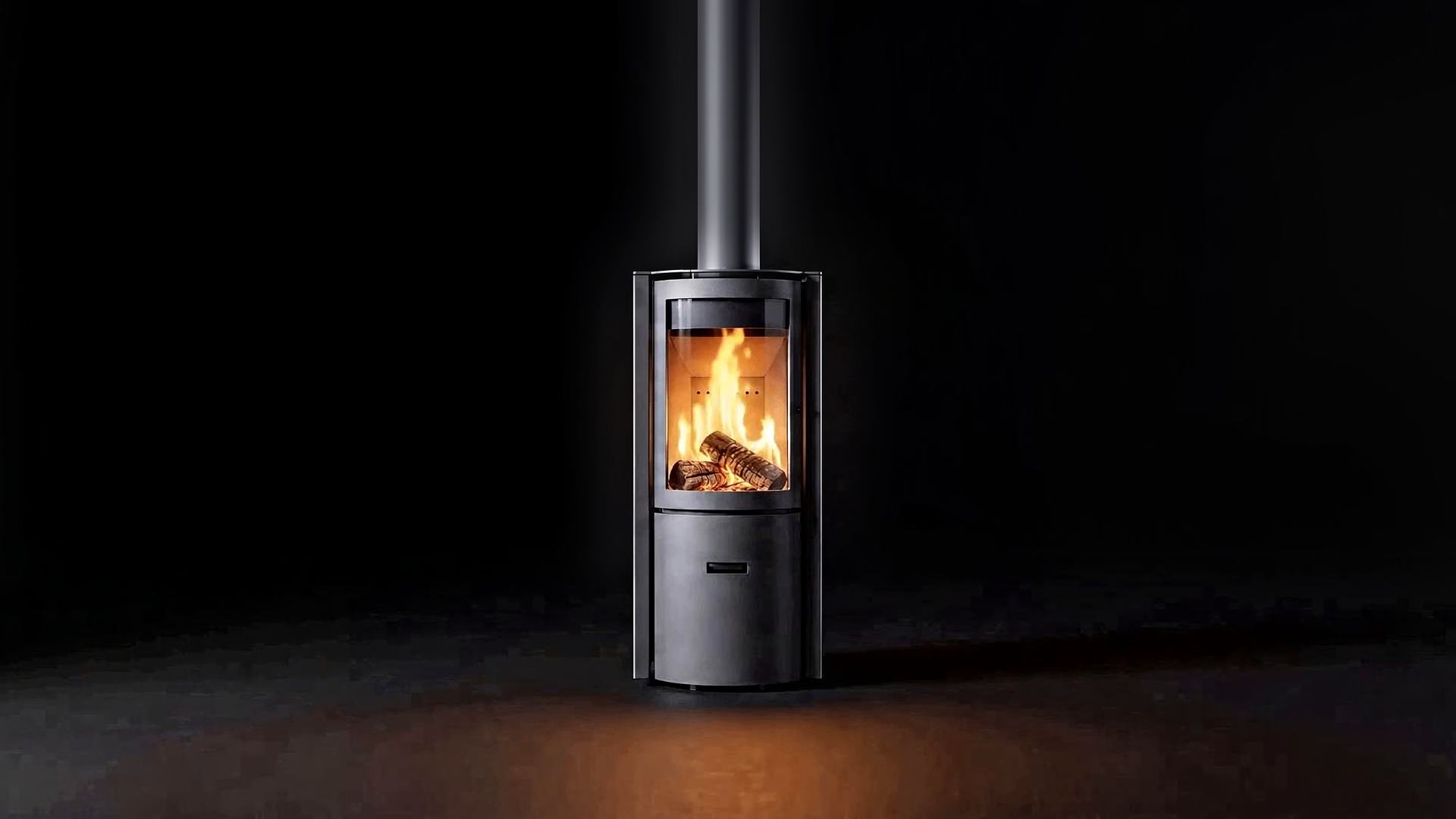 The Stûv 30 Compact burning straight-on in the black gallery