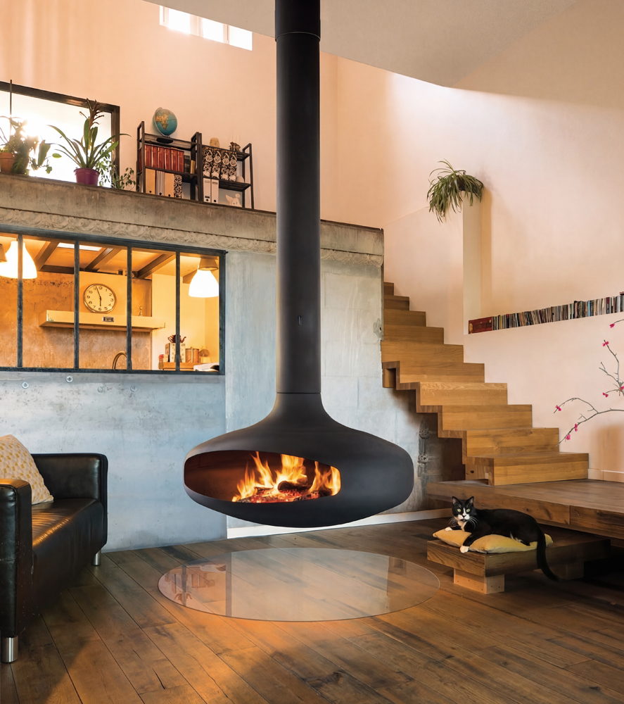 Domofocus roaring in a split-level loft, a cat asleep on the bench beside it