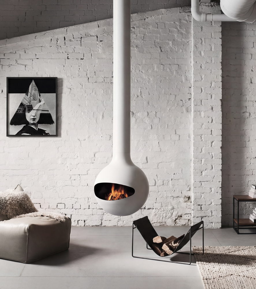 White Emifocus half-sphere mounted on a whitewashed brick wall above a butterfly chair