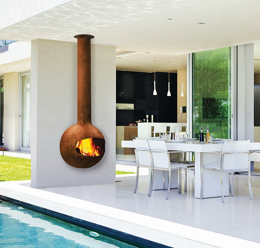 Rust Emifocus mounted on a white column over an outdoor dining table beside a pool
