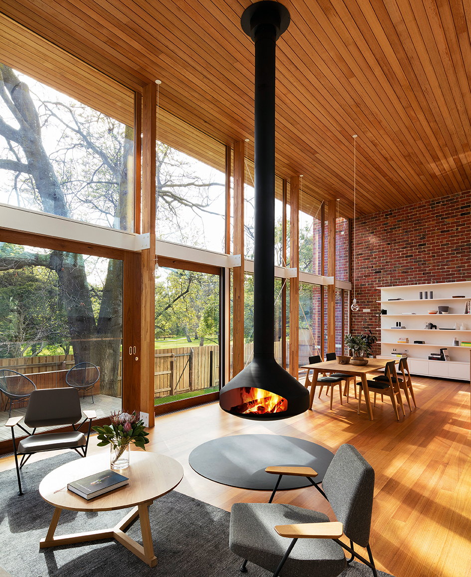 Ergofocus hanging from a high timber ceiling in a warm wood-lined great room