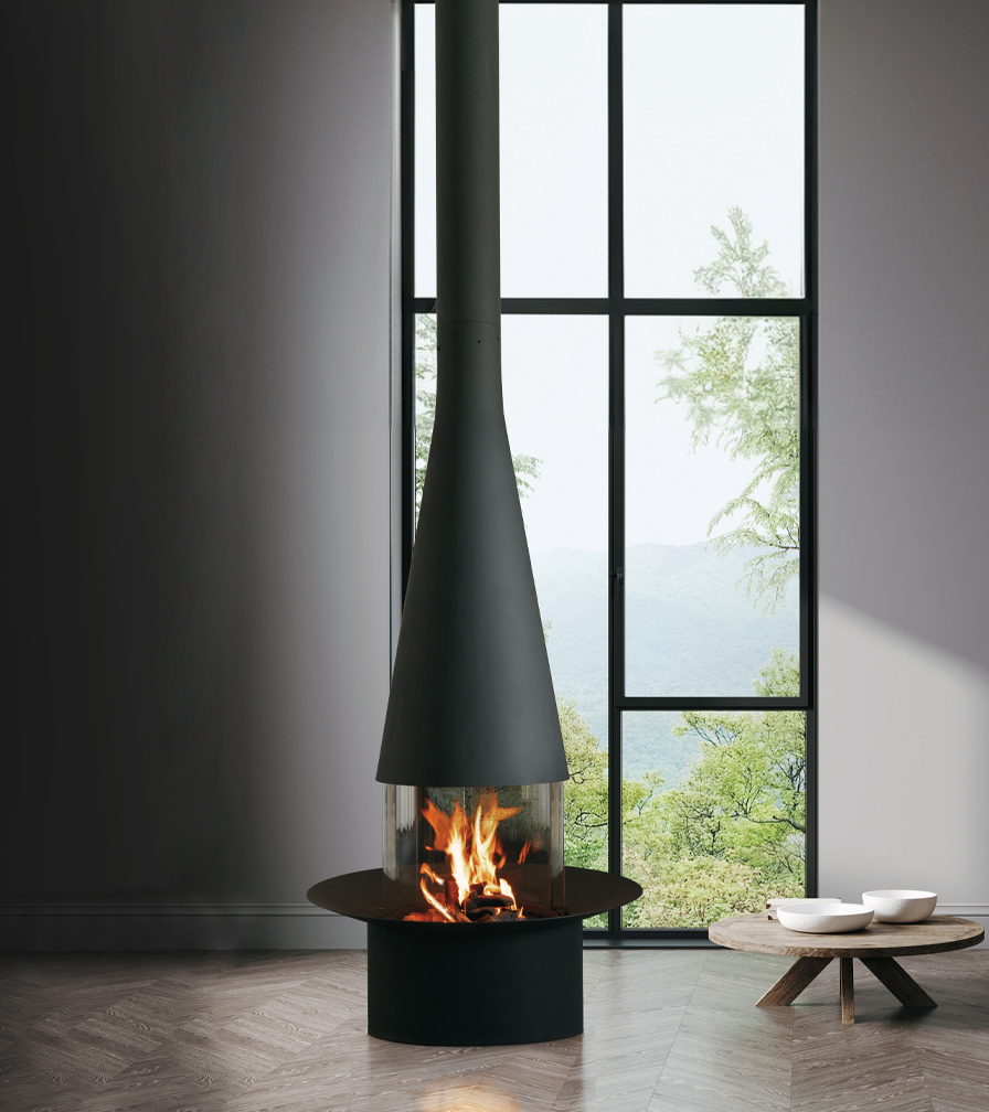 Filiofocus Central Gas burning in a grey room beside tall steel windows