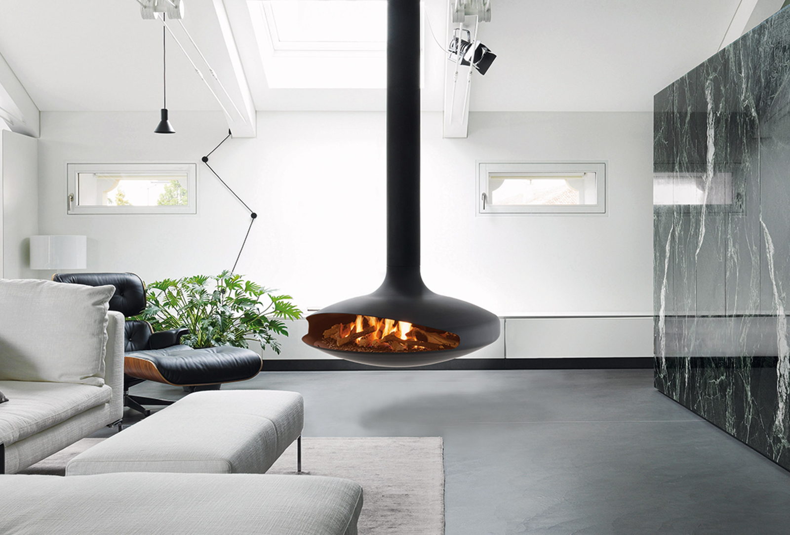 Black Gyrofocus Gas burning beside a marble wall in a modern living room