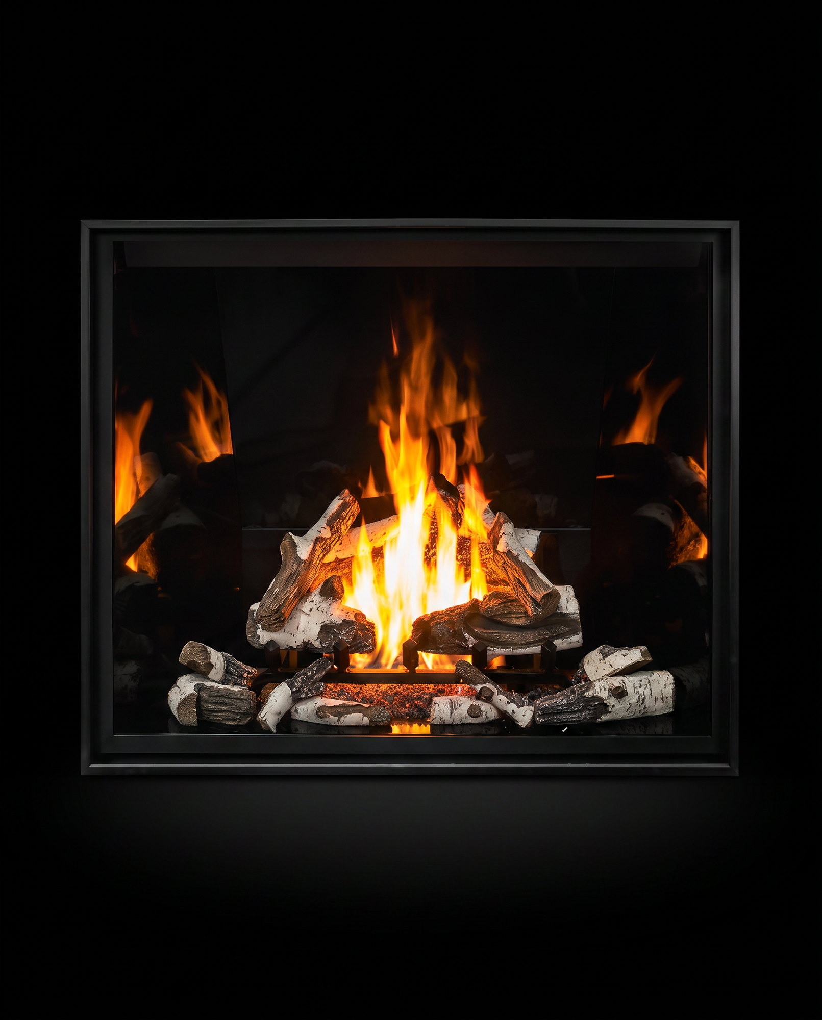 The U55’s wide clean face straight on — birch fire mirrored in black enamel