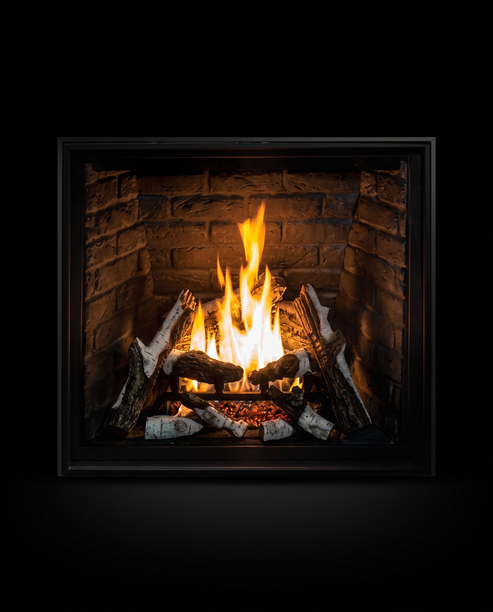 The U37’s clean square face straight on — birch fire on rustic brick