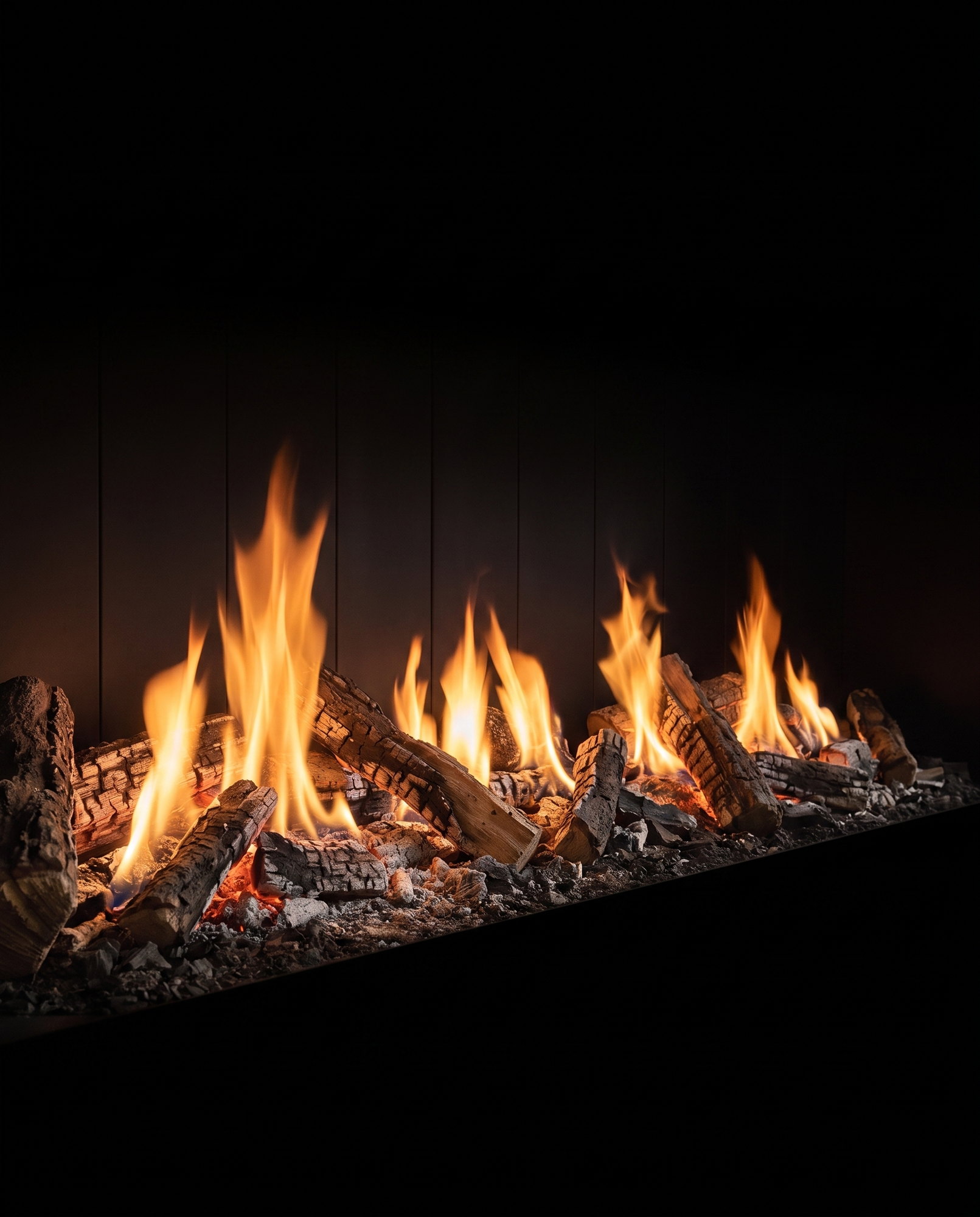 Down the U75’s bed — charred logs and tall flames receding along the seventy-five