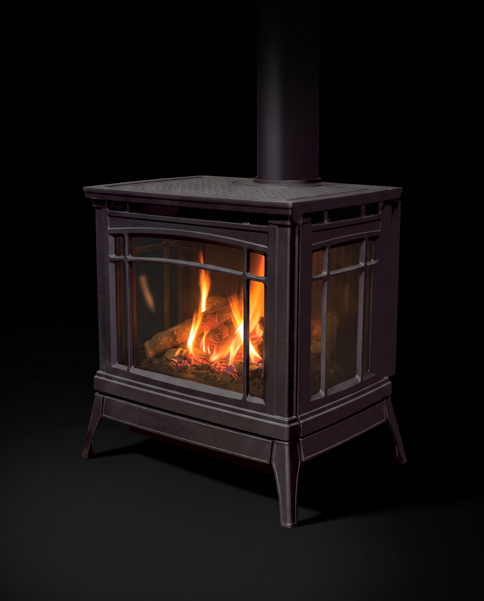 The complete Berkeley at a gentle angle — waffle top plate, side glass, splayed cast legs