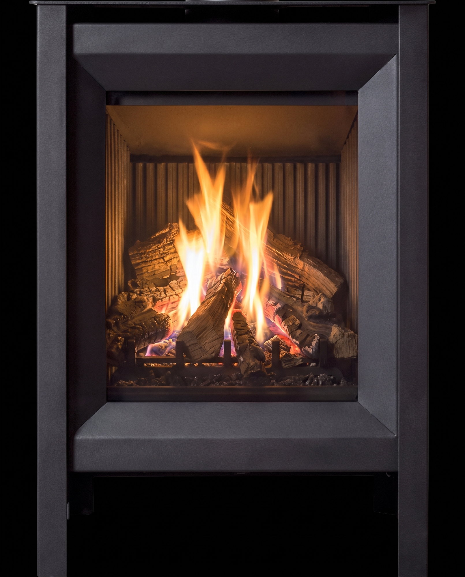 The S20’s upright glass dead-on — split-log fire on the charcoal fluted liner