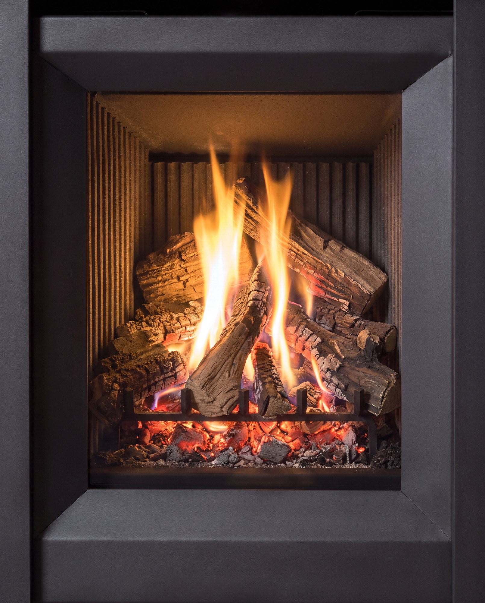 The S20’s split logs over a glowing ember bed, up close