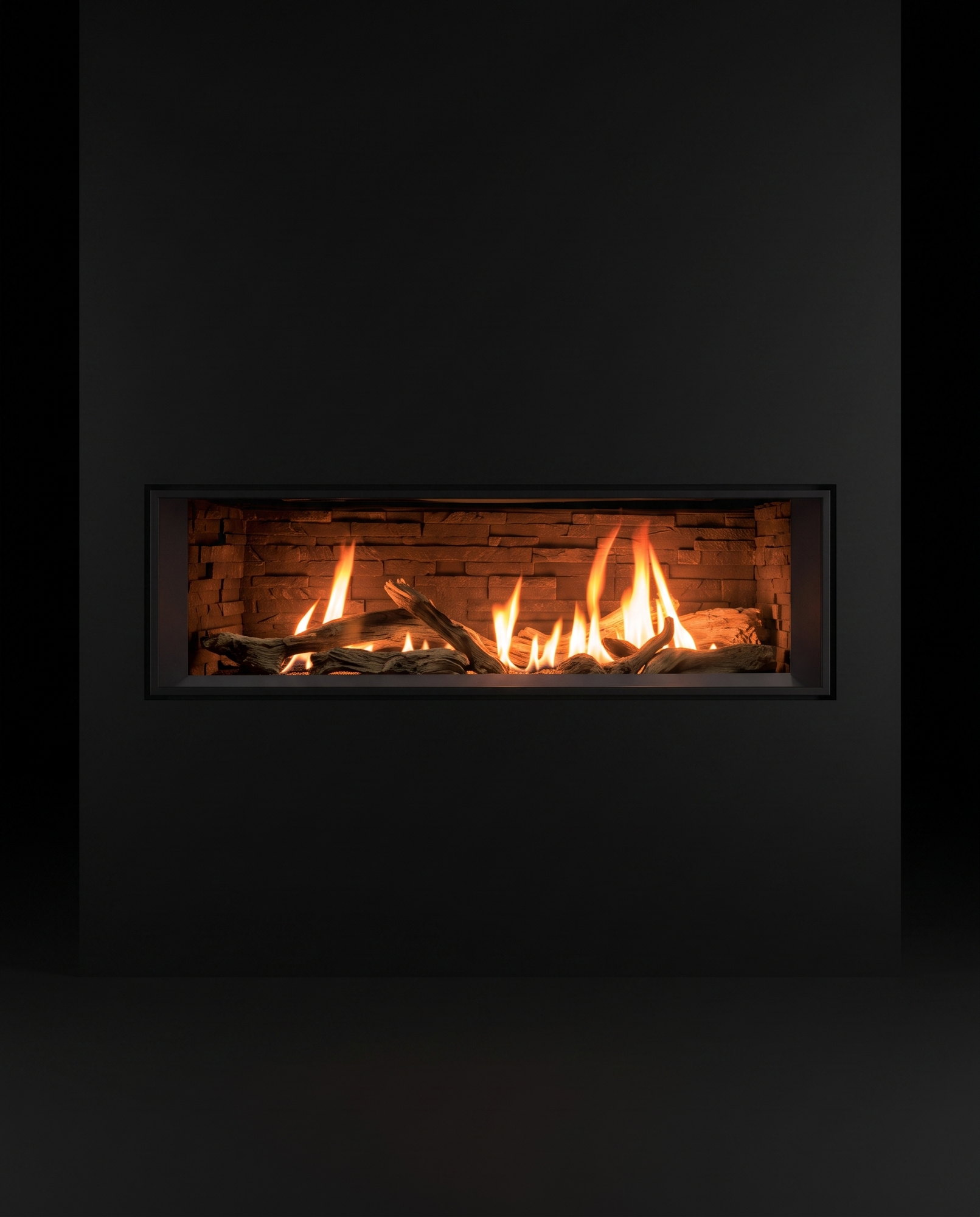 The C44’s full face dead-on — the ribbon of flame over its ledgestone liner