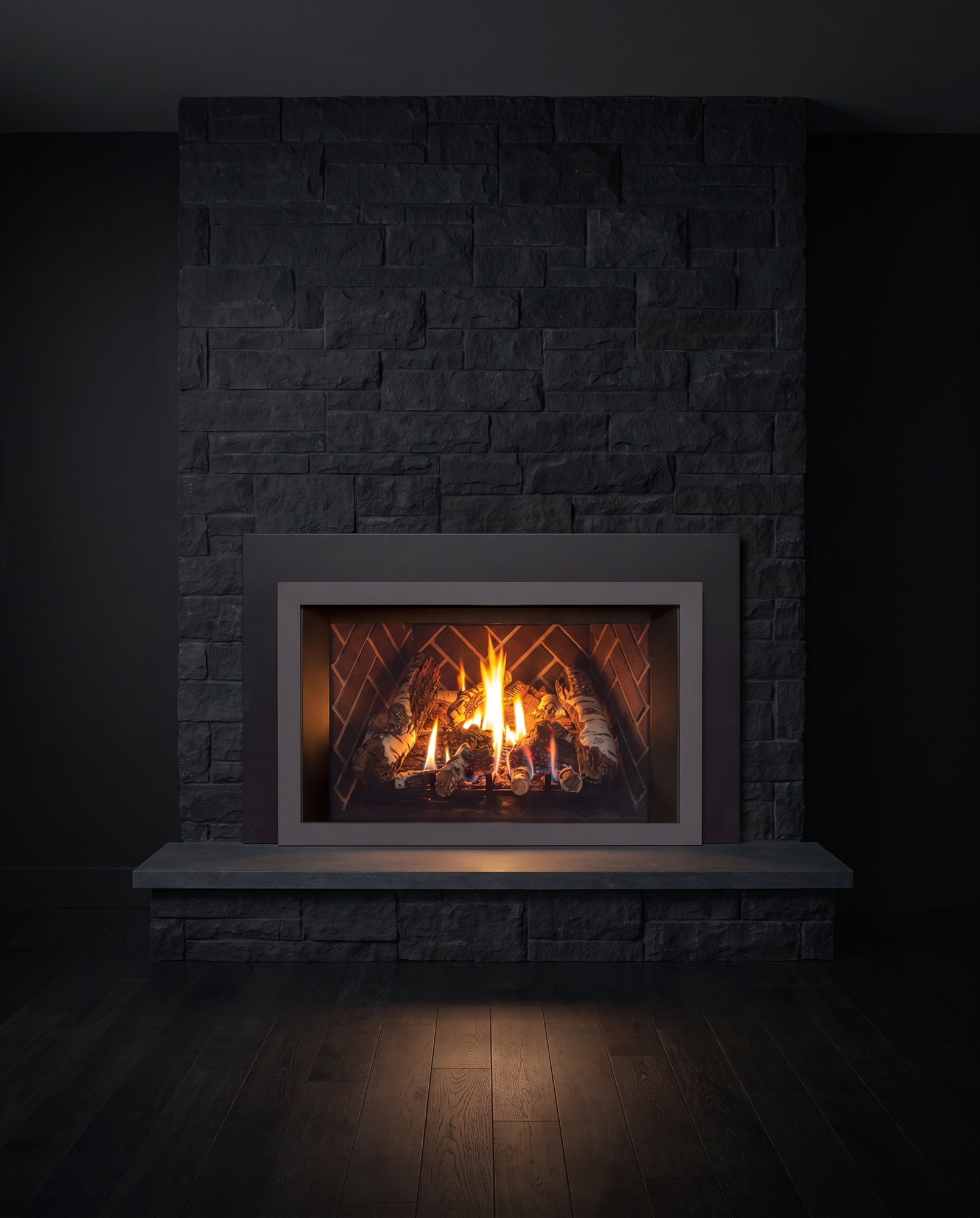 The Enviro E33 in a dark stone chimney breast