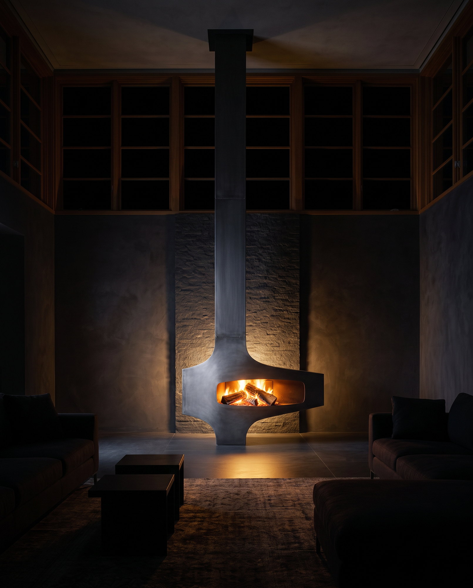 The Heterofocus standing in a dark stone-walled room, fire the only light