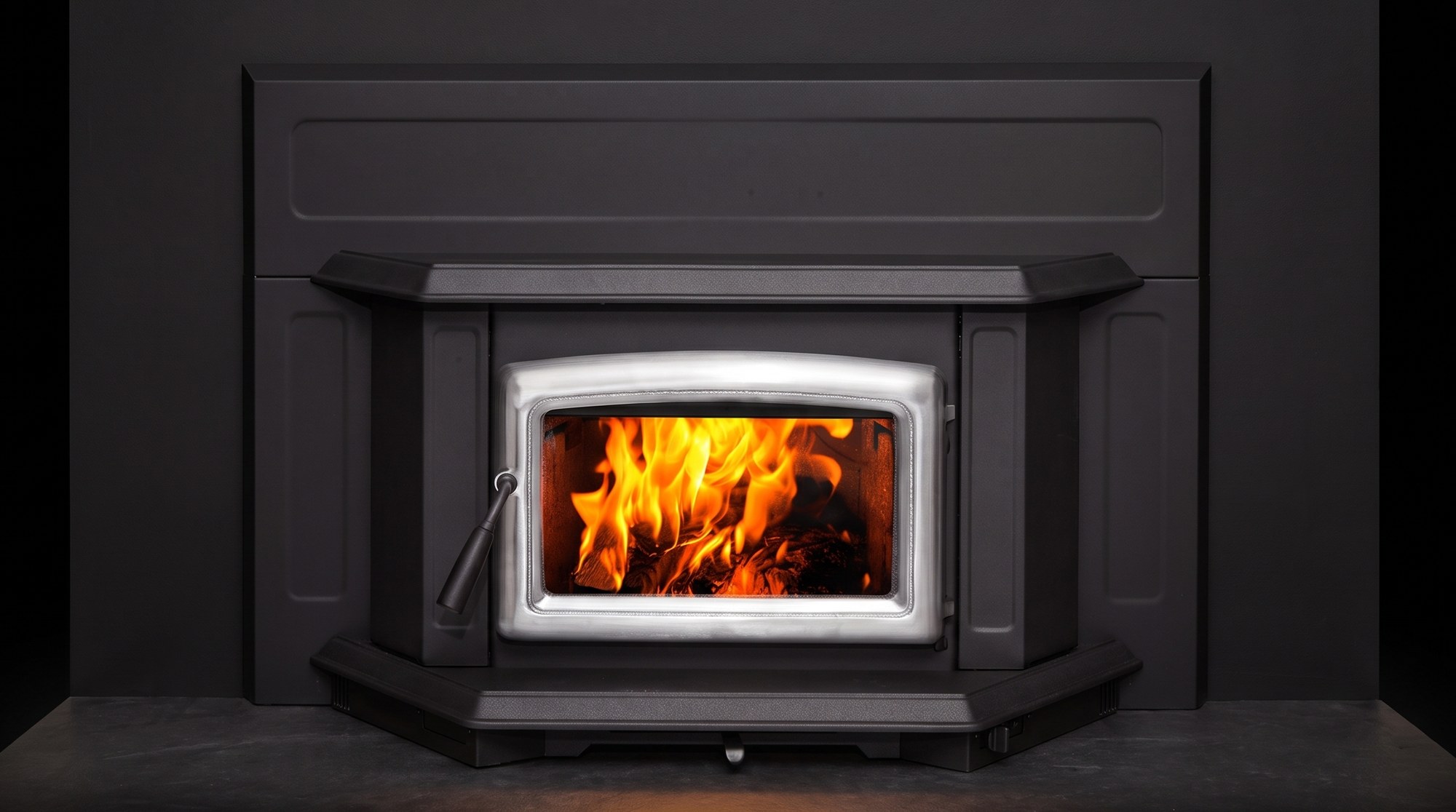 The Pacific Energy Super Insert LE, fire lit, in the black studio void