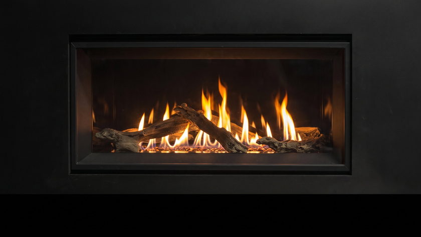 The Enviro C34 — gas fireplace — burning in the black studio void