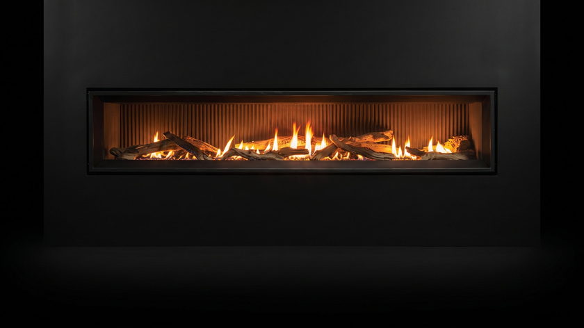 The Enviro C72 — gas fireplace — burning in the black studio void