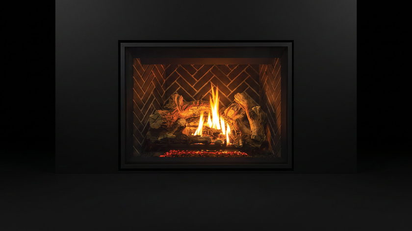 The Enviro G50 — gas fireplace — burning in the black studio void