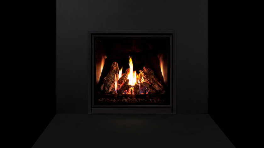 The Enviro Q3 — gas fireplace — burning in the black studio void