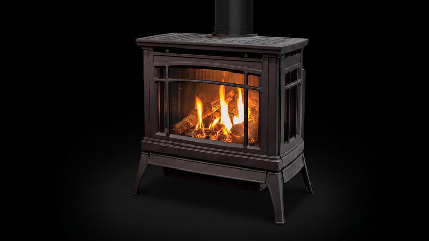 The Enviro Westley — cast iron gas stove — burning in the black studio void