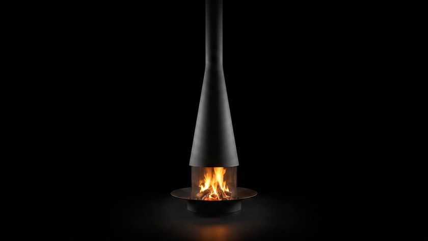 The Filiofocus — central fireplace — burning in the black studio void