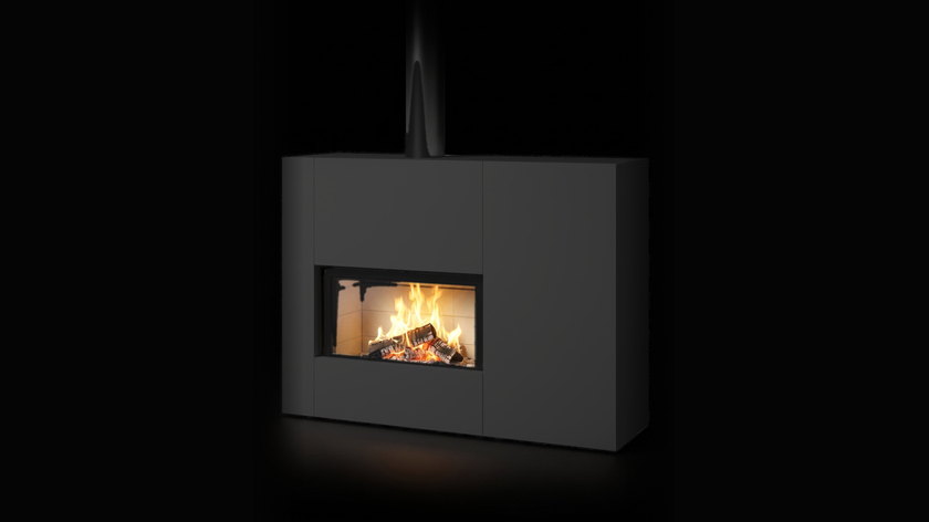 The Stûv 21-clad — ready-to-fit wood fireplace — burning in the black studio void