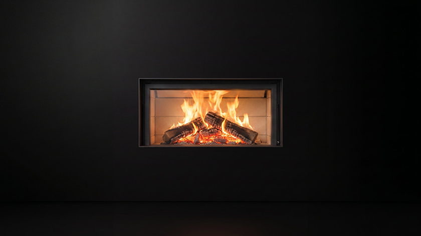 The Stûv 21 — wood fireplace — burning in the black studio void