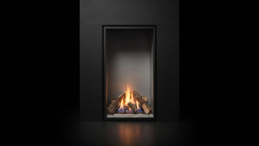 The Urbana U33 Tall — traditional gas fireplace — burning in the black studio void
