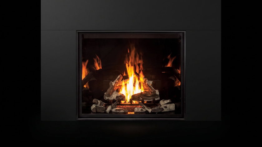 The Urbana U55 — traditional gas fireplace — burning in the black studio void