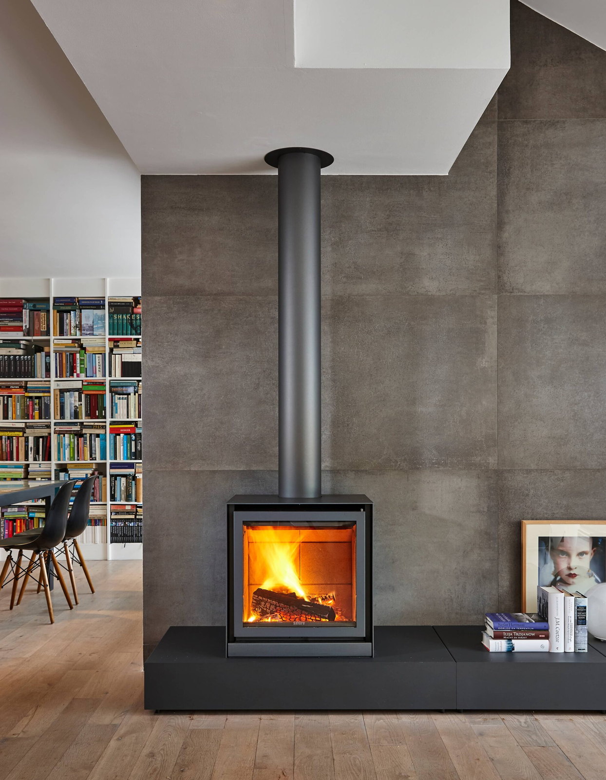 The Stûv 16-cube alight on its plinth before a full library wall