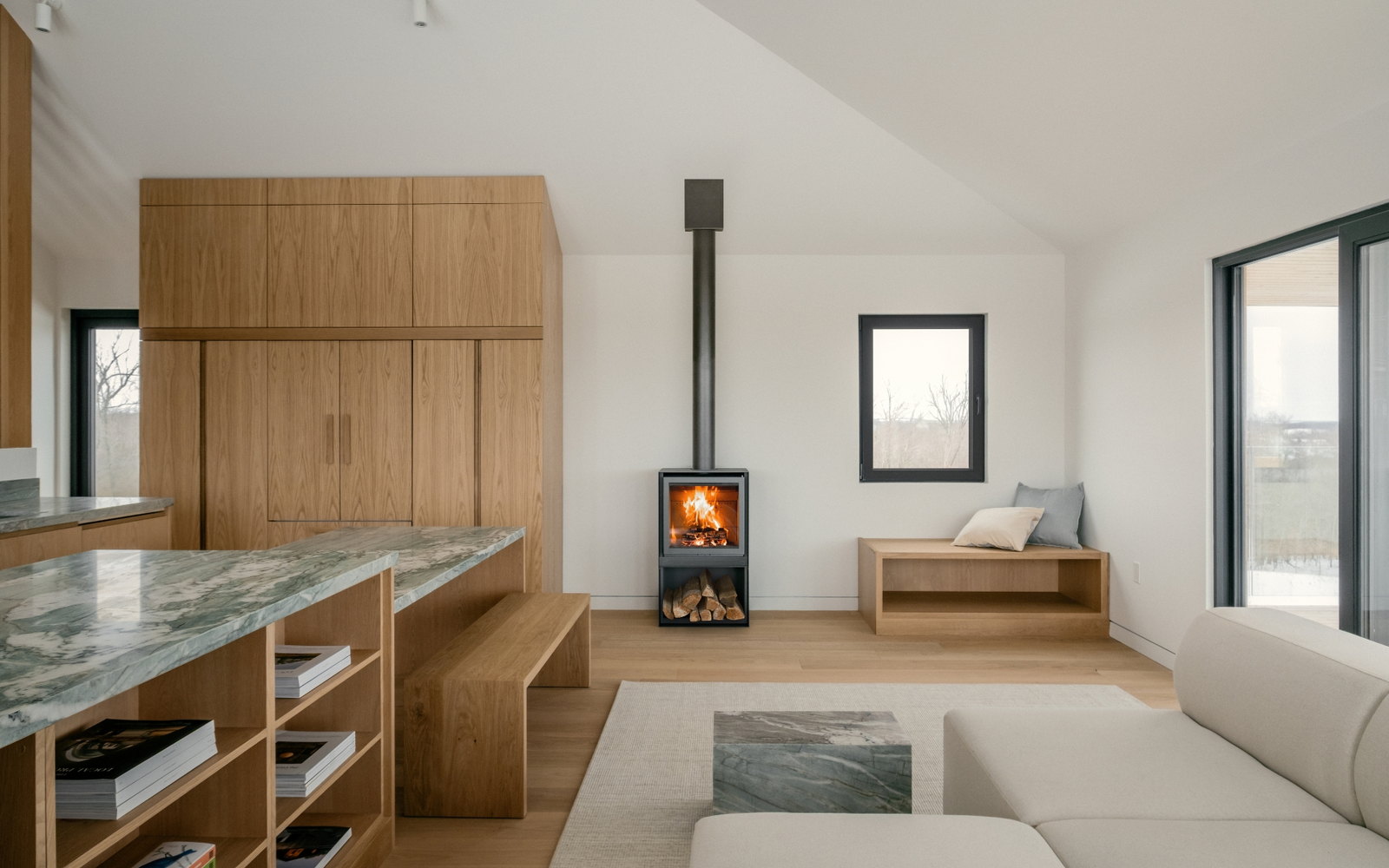 Stûv 16-H burning in the oak-panelled great room at Silver Heights, Trent Hills, Ontario