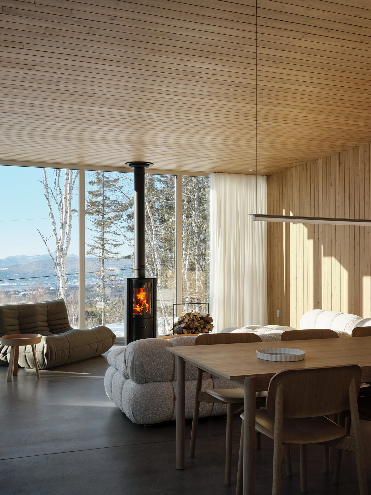 Stûv 30-compact alight by the window of an all-wood home above the St. Lawrence at Cap-à-l'Aigle, Charlevoix