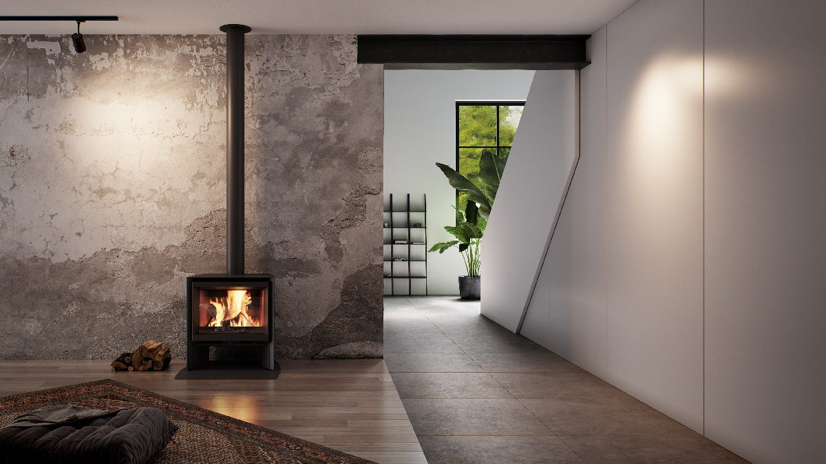 Stûv 6-H compact wood stove burning in a raw-plastered room