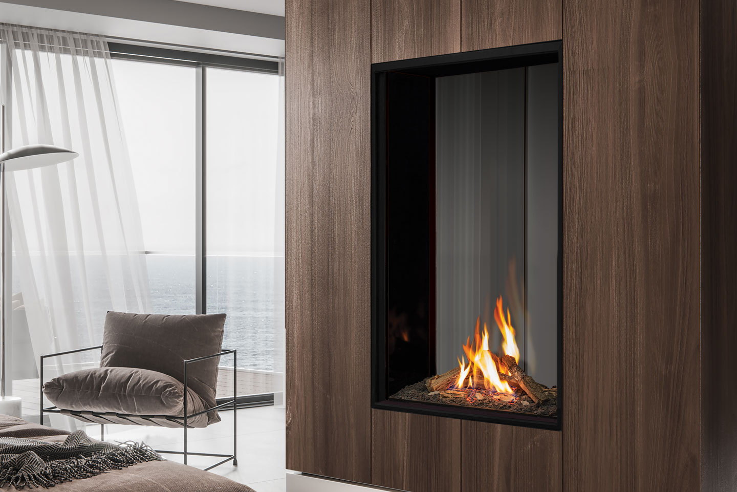 Urbana U33 Tall in a walnut panel wall beside a reading chair
