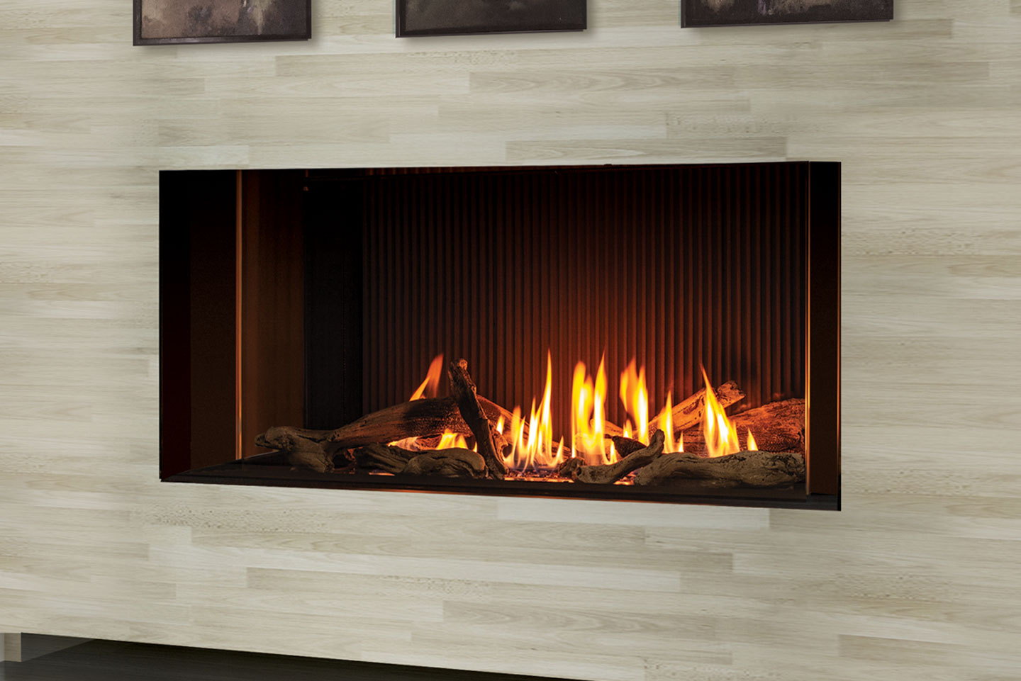Close view of the Urbana U50 Tall Linear burning in its pale stone wall