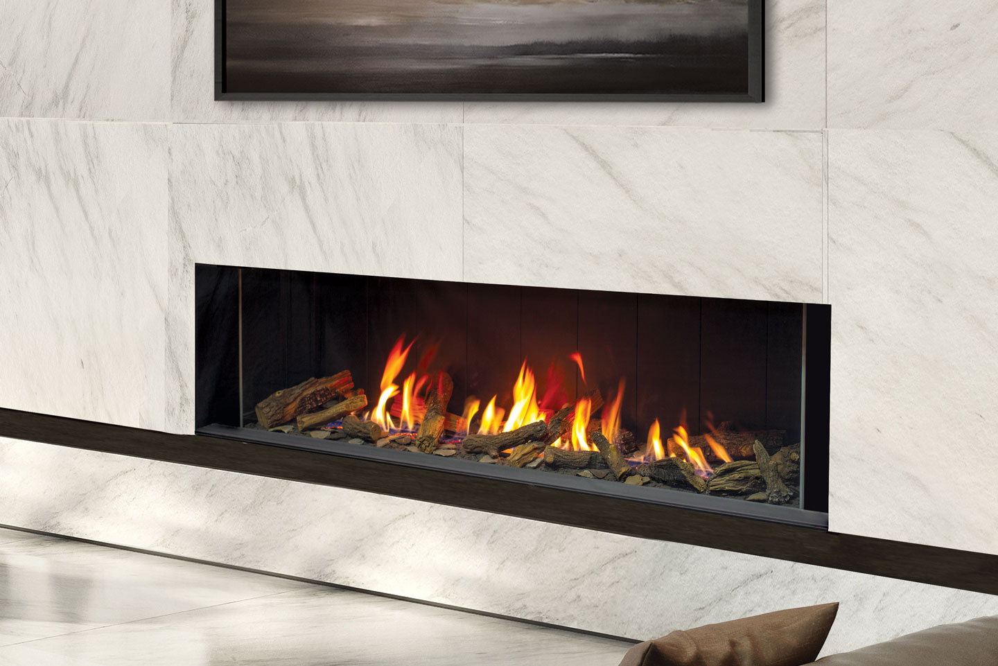 Urbana U70 Linear gas fireplace set into a white marble wall